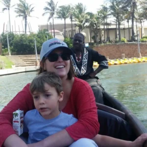 A mother and son enjoying the best value family boat rides in Durban with a scenic Zulumoon canal cruise.