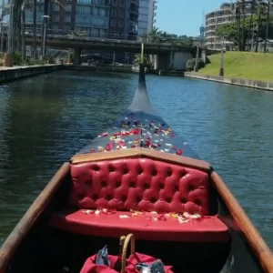 deluxe gondola ride for two featuring a private cruise along the waterfront with live music, perfect for milestone anniversaries.