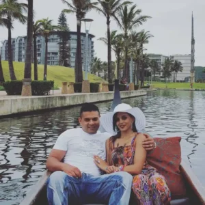 A happy couple sharing an intimate moment on a romantic boat ride for two along the Durban Point Waterfront.